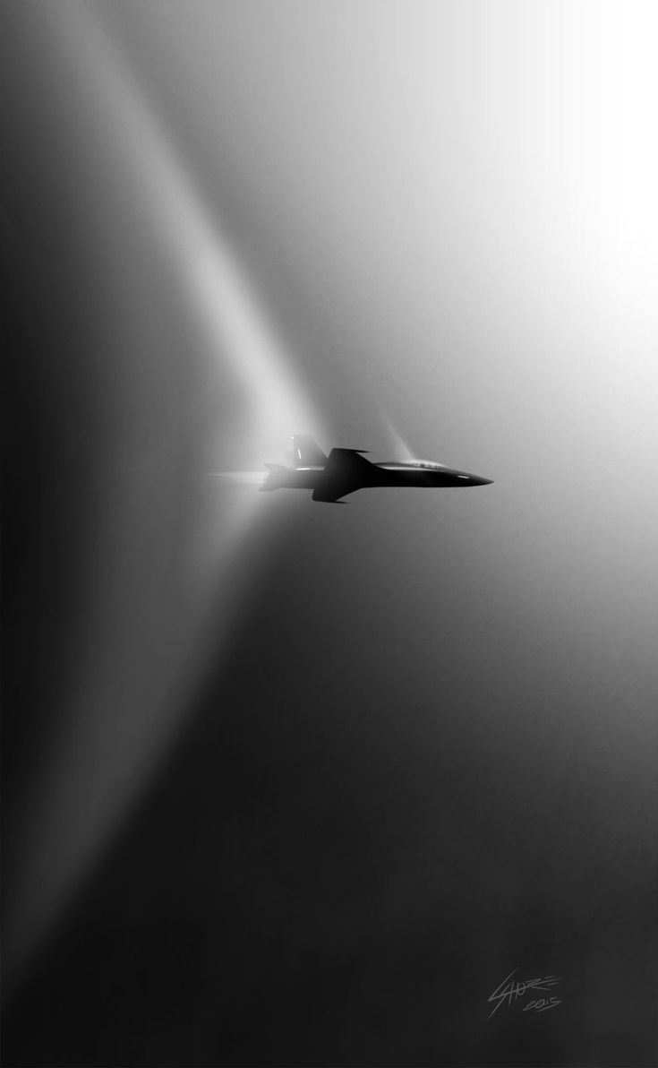 Jato rompendo a barreira do som, com ondas de choque visíveis ao redor da fuselagem